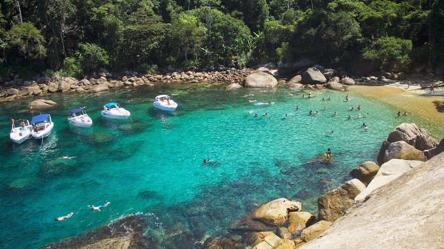 Aerial view of boats in turquoise waters of Trindade Beach