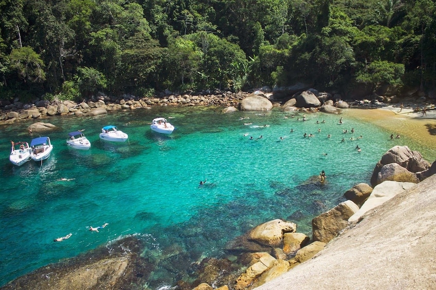 Aerial view of boats in turquoise waters of Trindade Beach