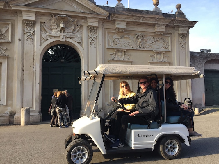 Tourists in golf cart in Rome, Italy