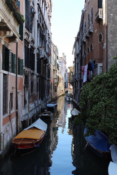 Boats in narrow canal in Venice, Italy