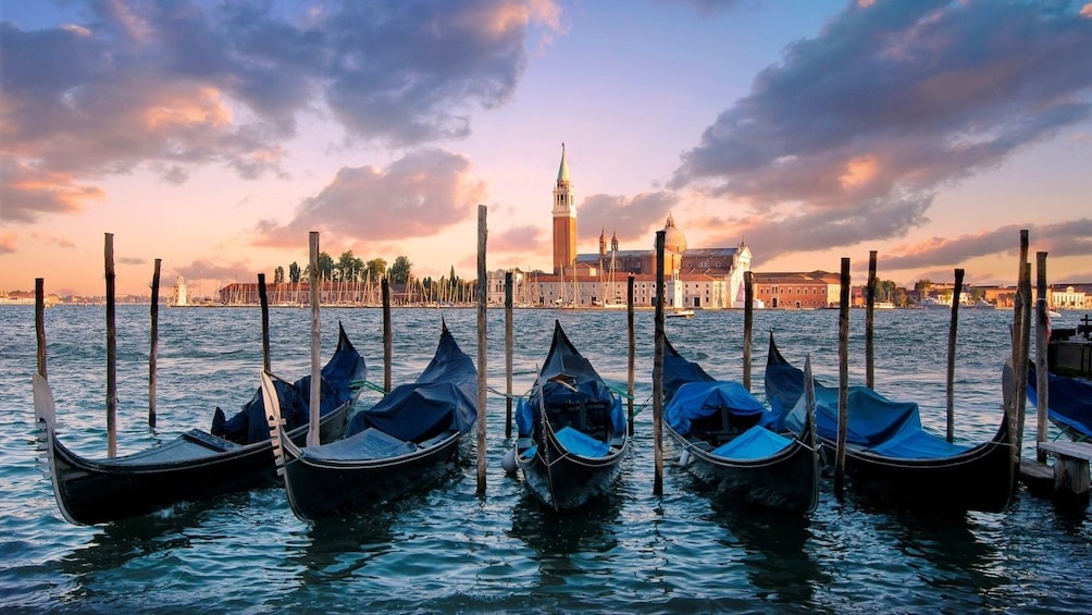 Gondolas docked at a canal in Venice