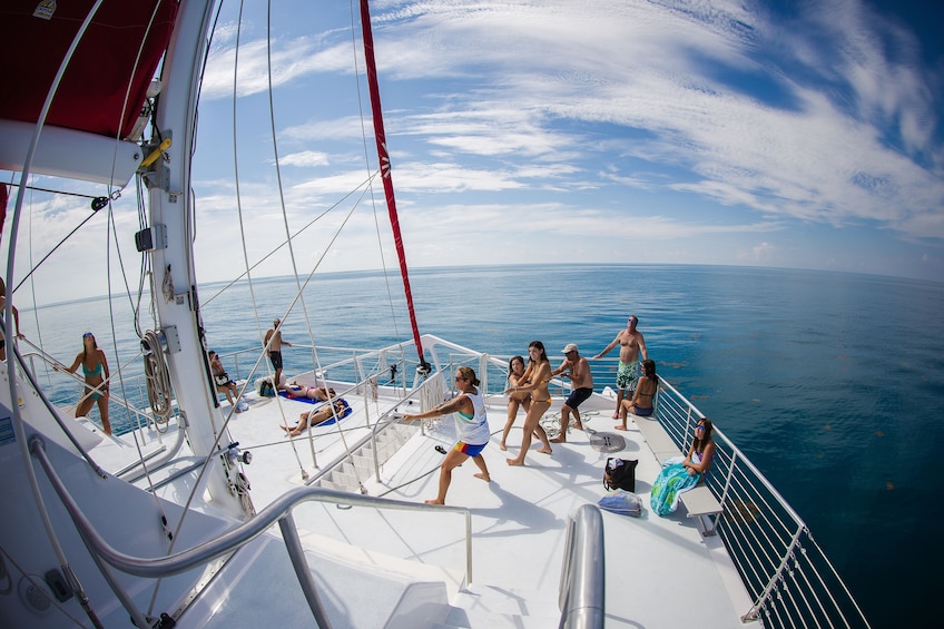 Woman steers sailboat in Key West