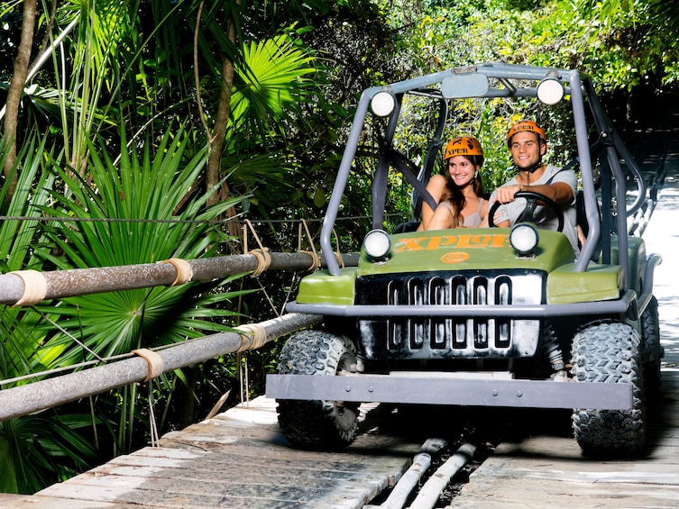 Couple driving a Jeep Wrangler in Xplor