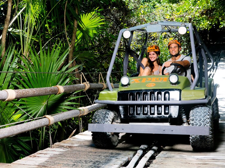 Couple driving a Jeep Wrangler in Xplor