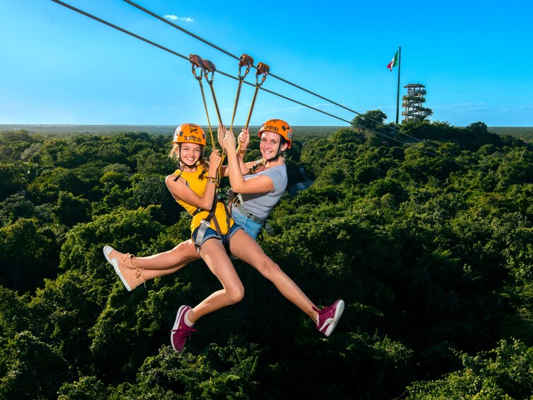 Mother and daughter zip-lining at Xplor