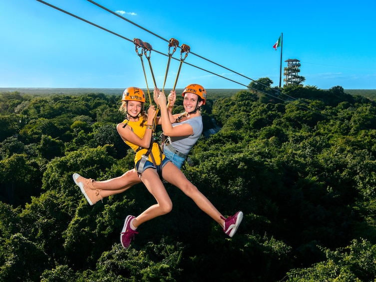 Mother and daughter zip-lining at Xplor