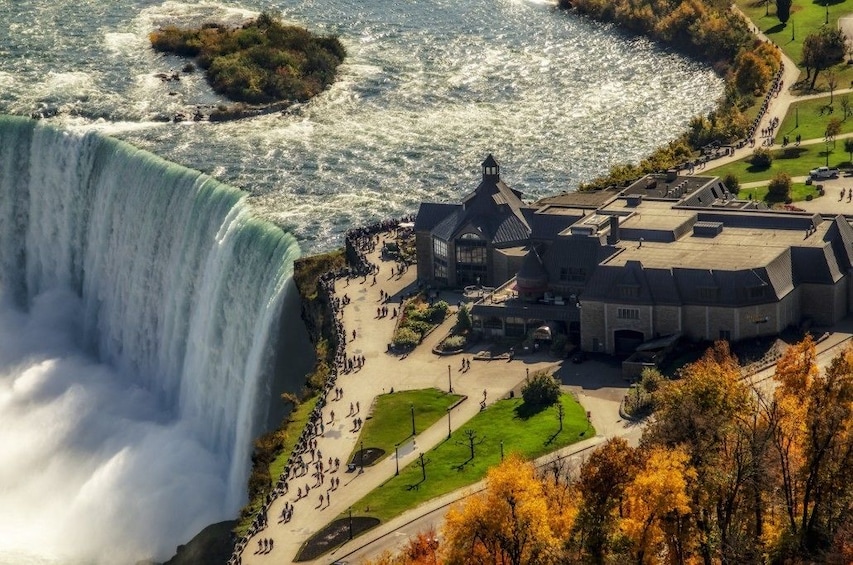Aerial view of top of Niagara Falls and nearby building