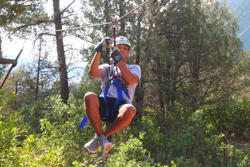 Man zip lines in Durango, Colorado