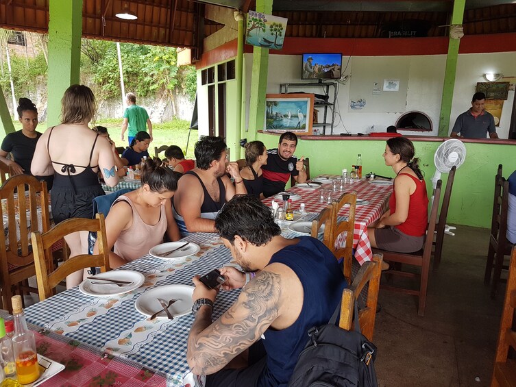 Tour group at restaurant in Presidente Figueiredo, Brazil