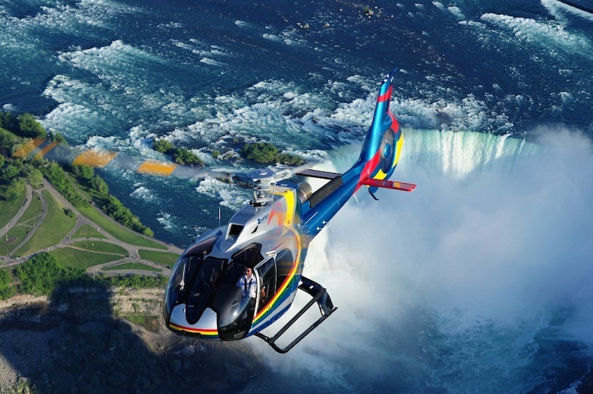 Helicopter flies over Niagara Falls