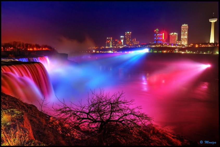 Red and blue lights shine on Niagara Falls