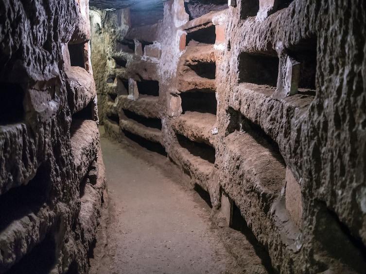 Lit corridor of the Roman Catacombs