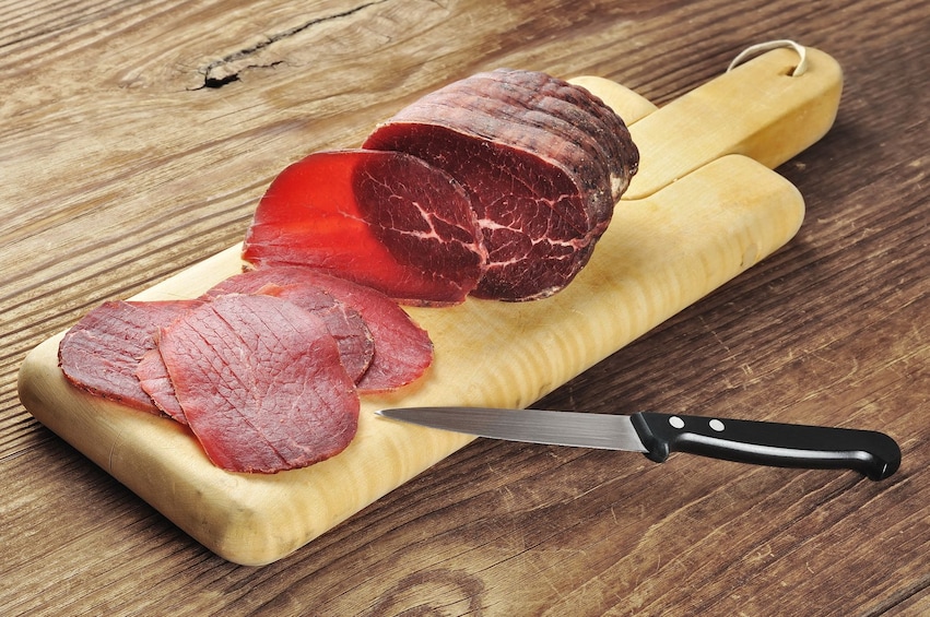 Slices of cured meat on a wine tour in Italy