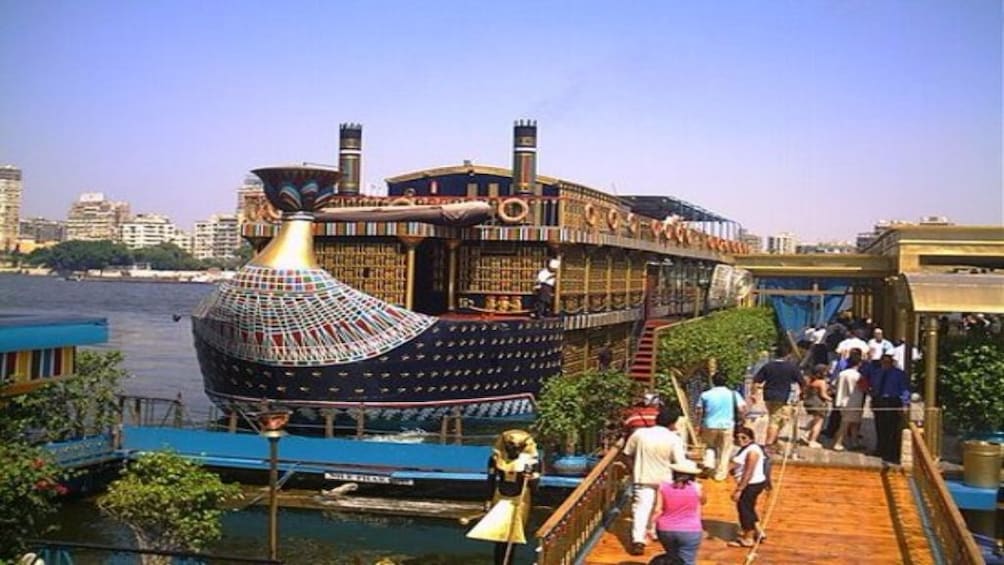 Tourists board cruise ship on the Nile