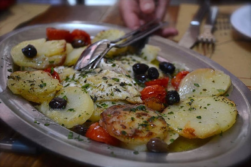 Closeup of potato, tomato, and olives