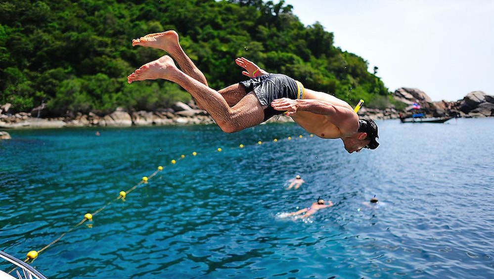 Man jumping into the waters of Koh Nangyuan