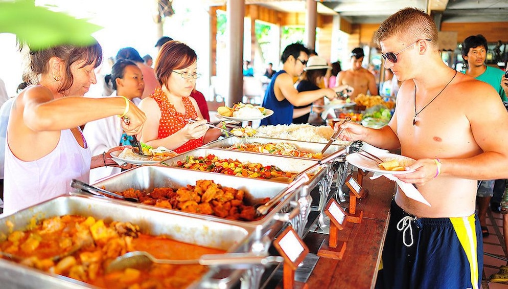 Tourists enjoying a delicious buffet lunch on Koh Nangyuan