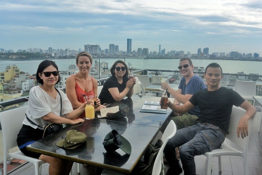 Group at a rooftop restaurant in Hanoi