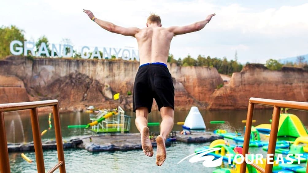 Perosn jumping off a diving platform