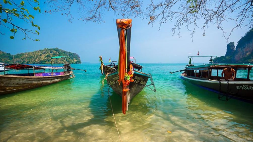 Boats floating off the shore in Thailand