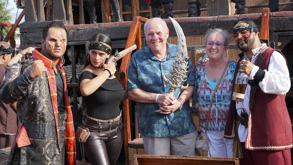 Couple pose with pirates on ship in Puerto Vallarta 