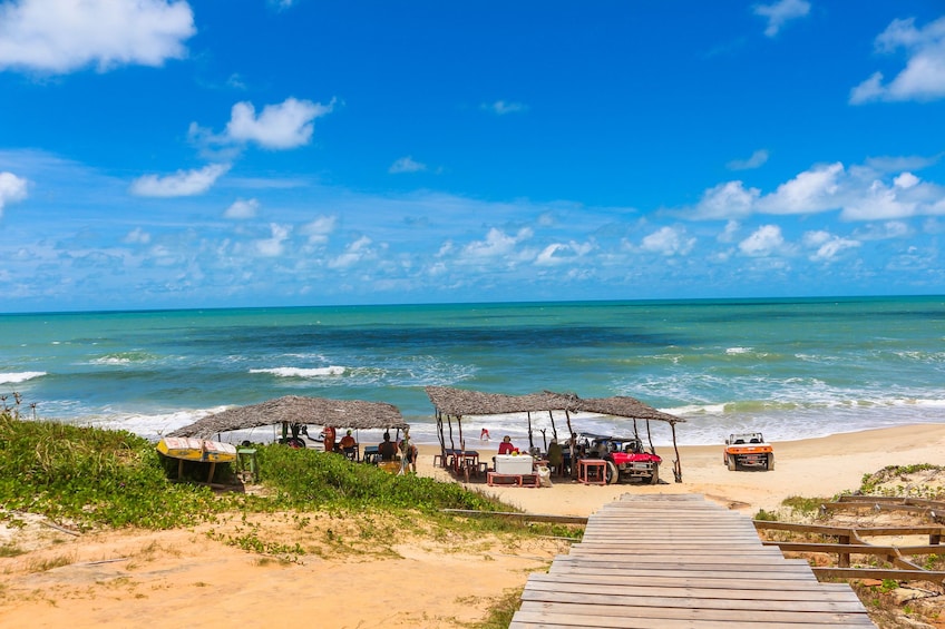 Boardwalk and covered bungalows at Beach of Morro Branco