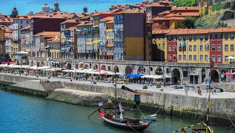Vibrant riverside view of Porto on a sunny day