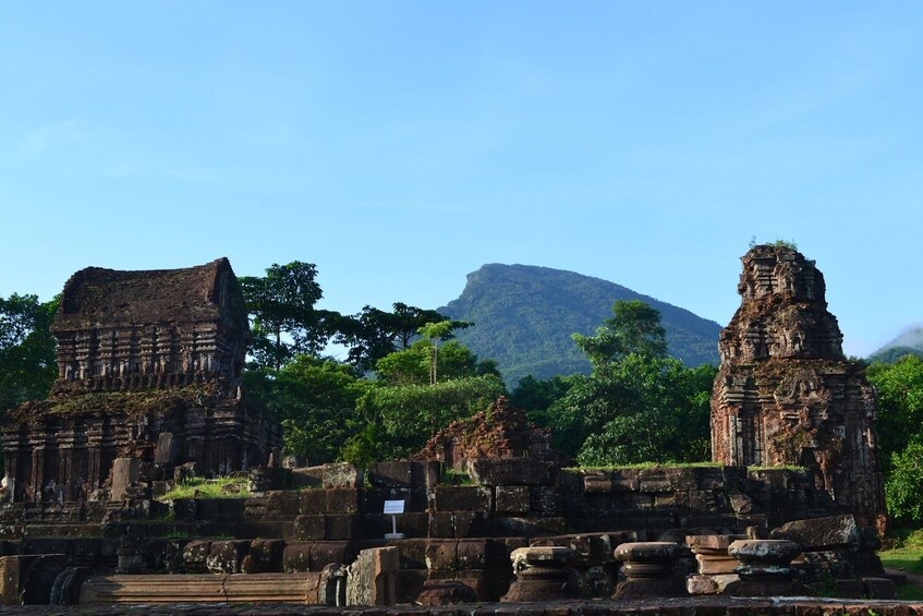 Mỹ Sơn Sanctuary with mountain in the background