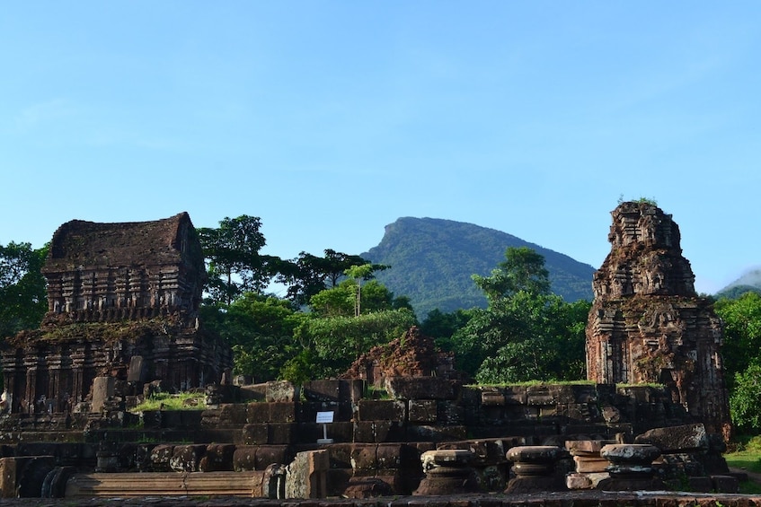 Mỹ Sơn Sanctuary with mountain in the background