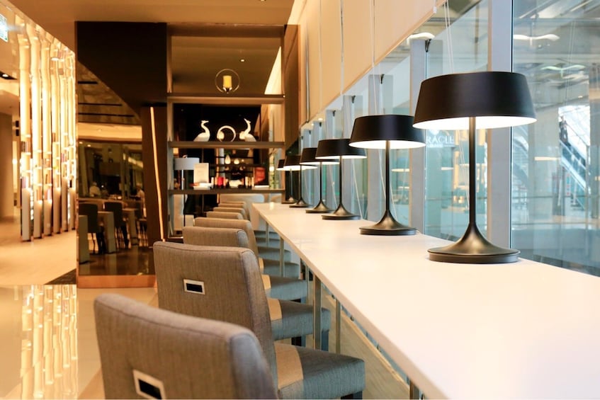 Seating area and lamps at the Miracle Lounge in Bangkok Airport