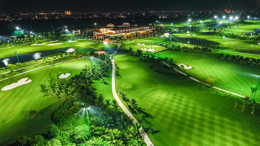Aerial view of golf course lit up at night
