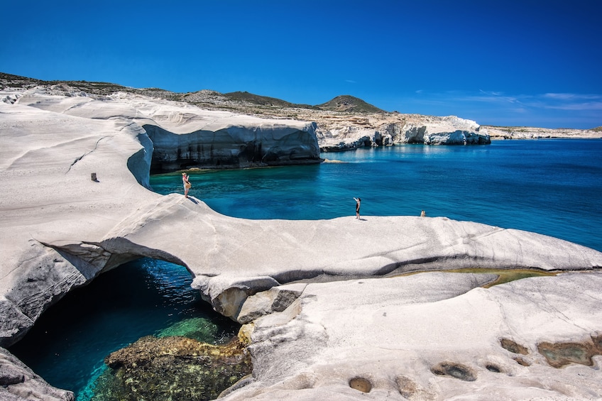 Bright blue lagoon of Milos Island in Greece