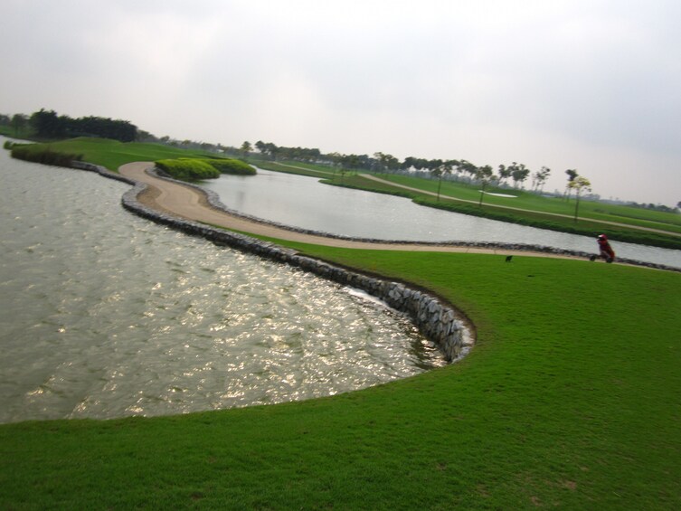 Two lakes with path in between on Vietnamese golf course