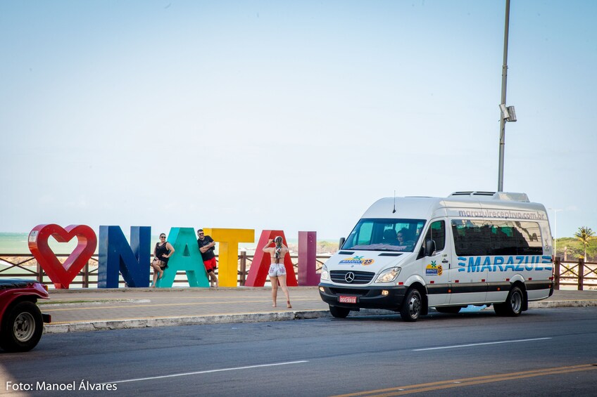 Van by large "Amo Natal" sign in Natal, Brazil