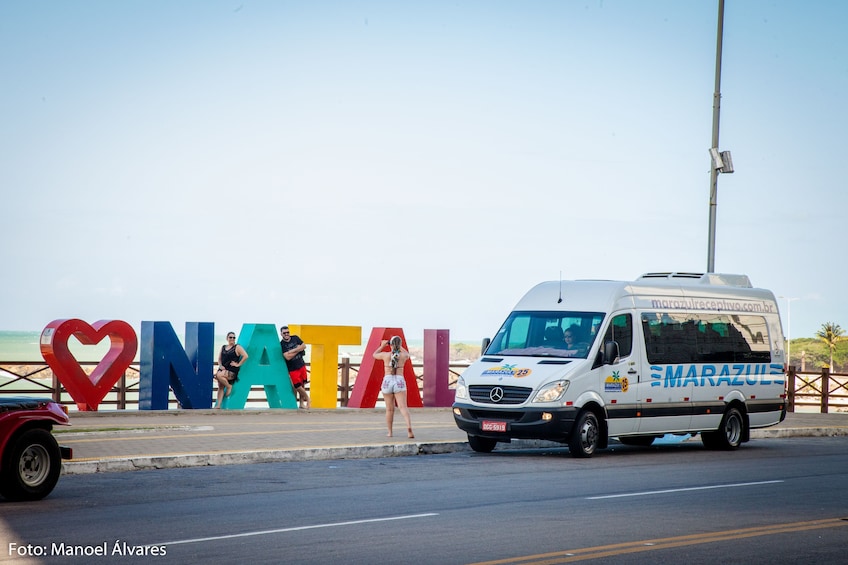 Van by large "Amo Natal" sign in Natal, Brazil