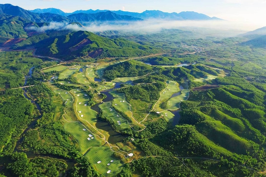 High aerial view of Ba Na Hills Golf Club and surrounding forest