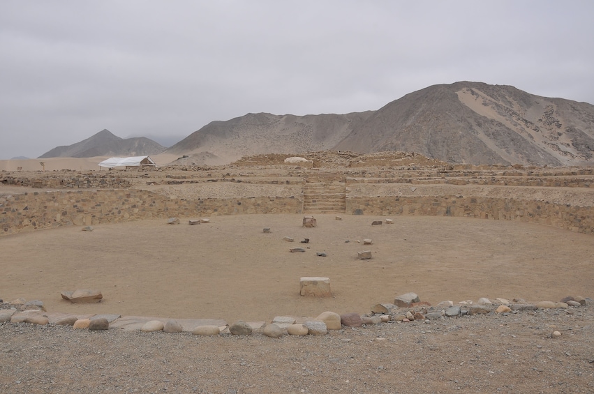 Short, round stone wall at Caral settlement