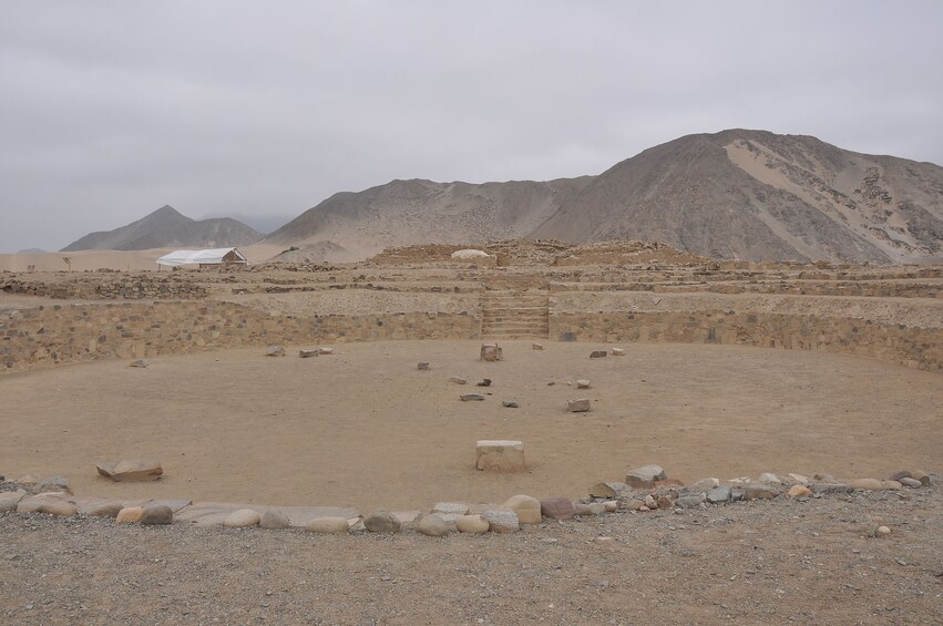 Short, round stone wall at Caral settlement