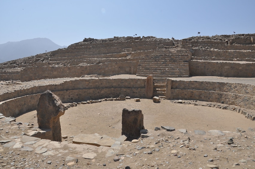 Stone circle and stairs at Caral settlement on a sunny day