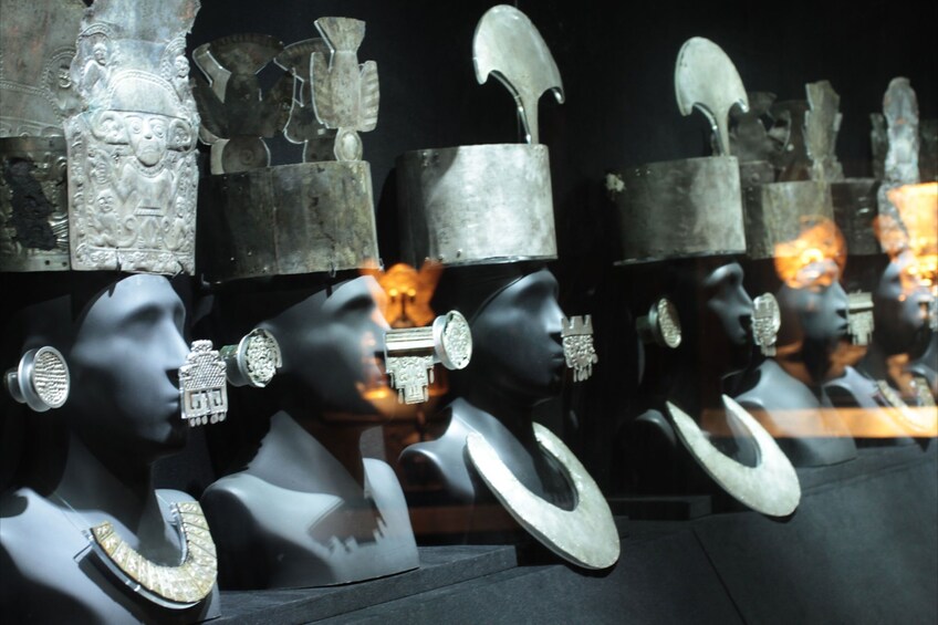 Busts with metal jewelry at the Larco Museum