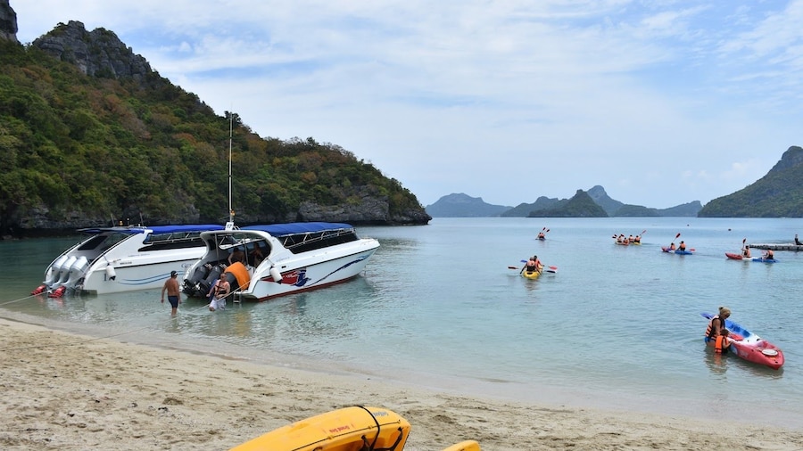 Kayaks and small boats on the beach in Thailand