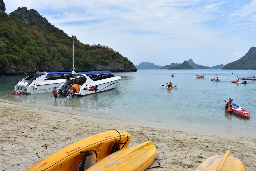 Kayaks and small boats on the beach in Thailand
