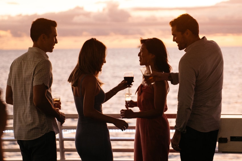 Two couples aboard the Majestic at sunset