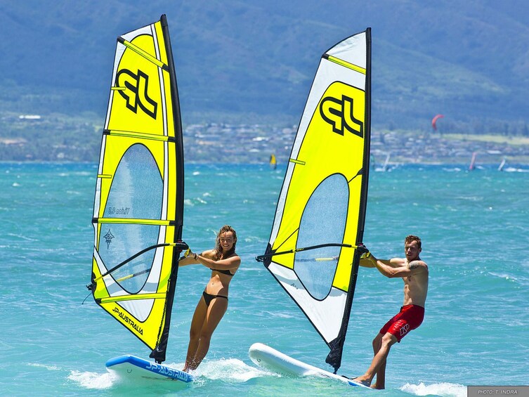 Man and woman windsurf in Miami