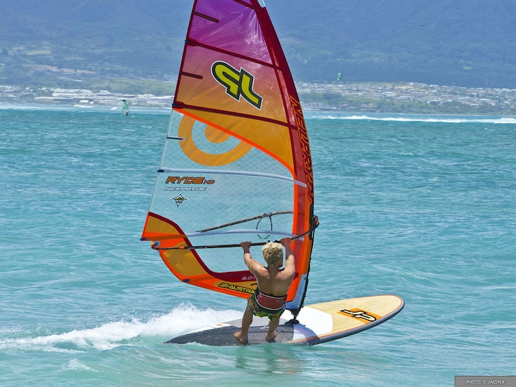 Woman windsurfs in Miami