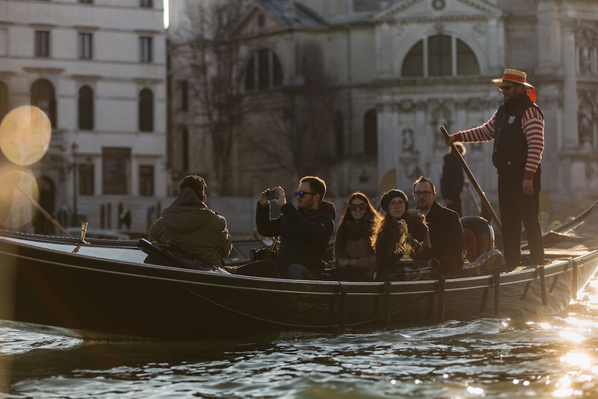 Venice canal tour on a Gondola at dusk