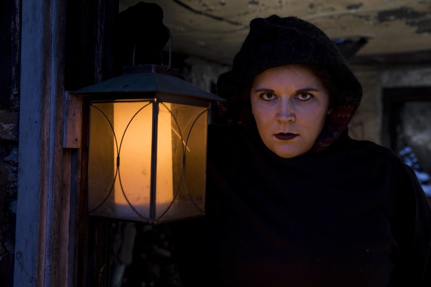 Woman on a ghost walk in Banff