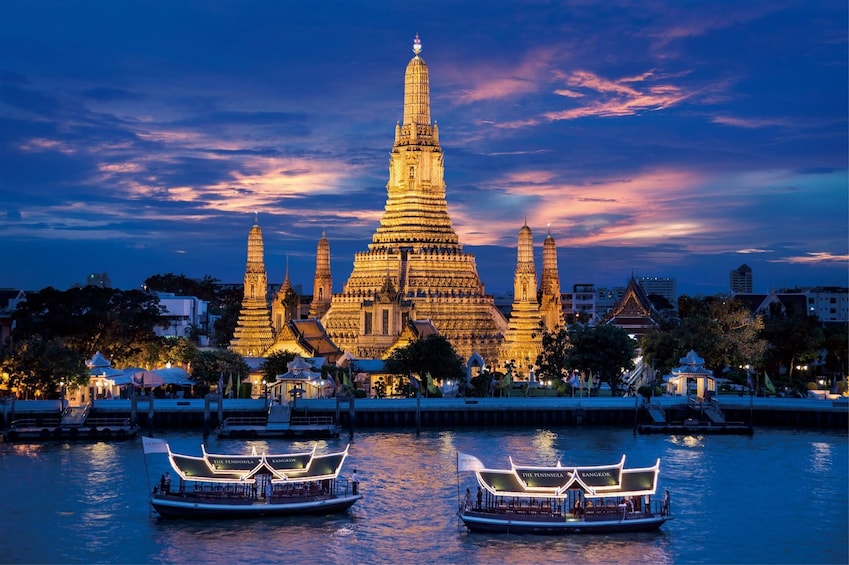 Night view of the Wat Arun Ratchawararam temple in Bangkok, Thailand