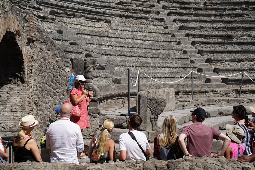 Tour group in the Amphitheatre of Pompeii