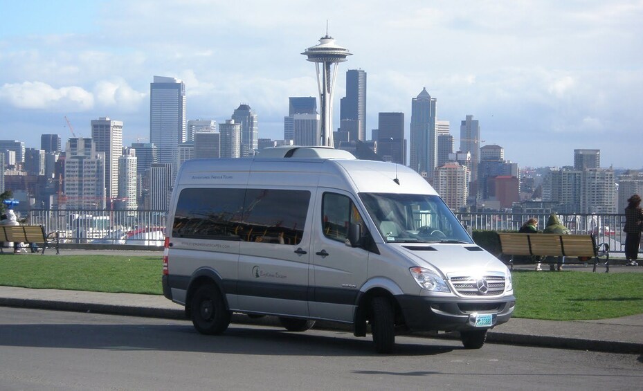 Van in Seattle with view of the Space Needle and downtown